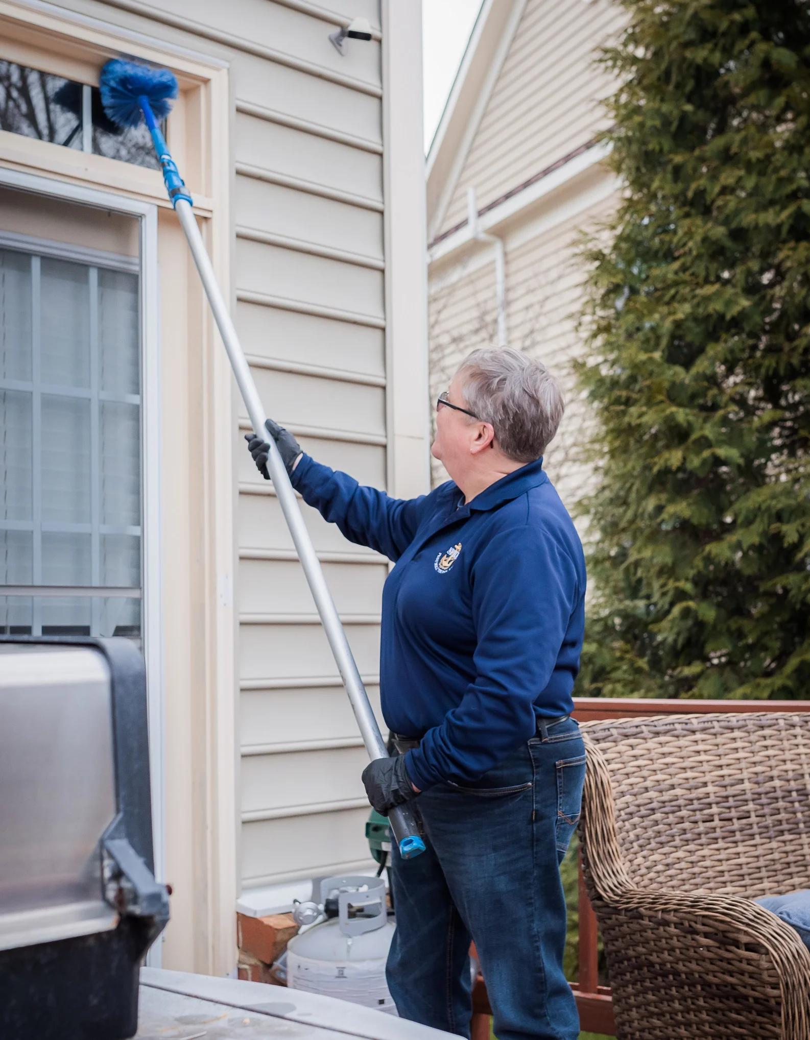SPRK Pest Solutions technician serving a wooded estate property in Great Falls, Virginia